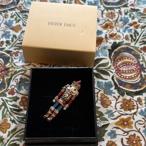 Heidi Daus Festive Nutcracker Brooch with Red and Gold
